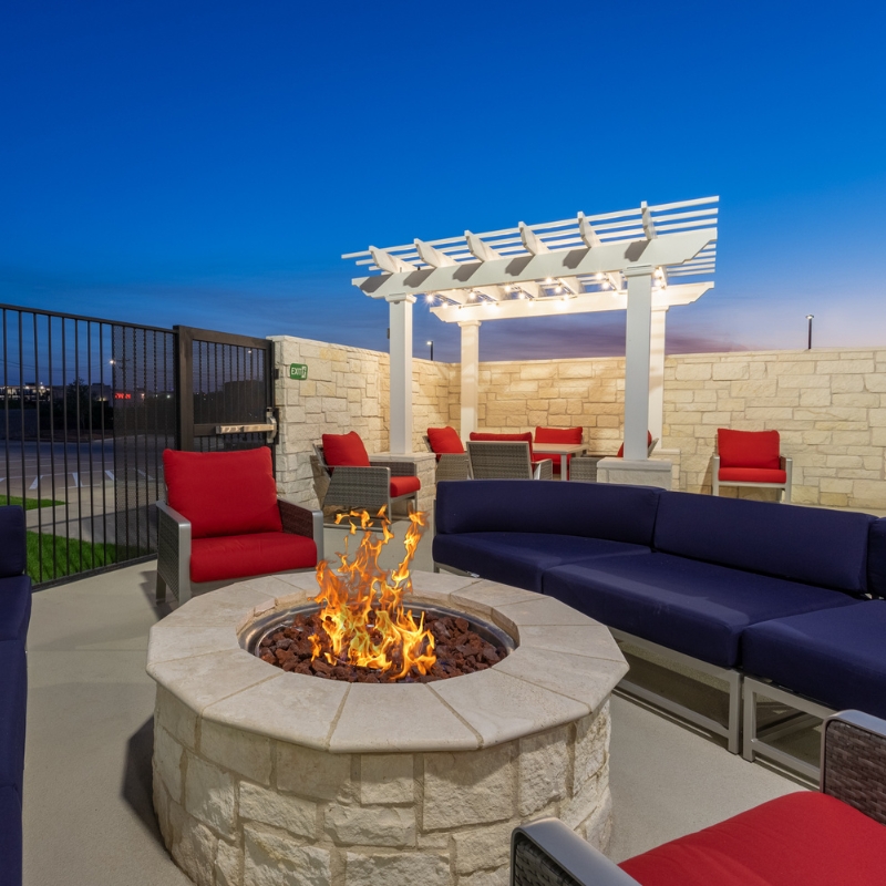 Relax by the fire pit at AmericInn San Angelo